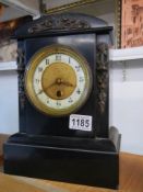 An old slate mantel clock. COLLECT ONLY.