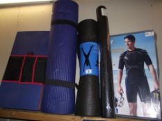A quantity of yoga/excercise mats and a Shortie wetsuit size xxl COLLECT ONLY