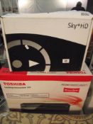 A Toshiba vcr/dvd digital recorder dvr 20 in box and a Sky + HD in box