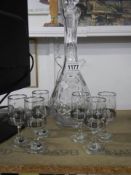 An early 20th century tall decanter and six gold rimmed glasses, COLLECT ONLY.
