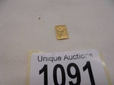 A one gram ingot of fine gold (9.999).