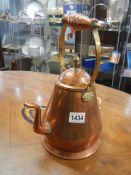 An old copper water jug.