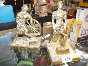 A brass blacksmith figure and a brass executioner/hangman/headsman figure