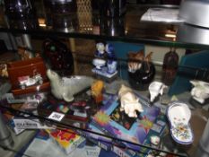 A good selection of ornaments including Sylvac, Wade etc