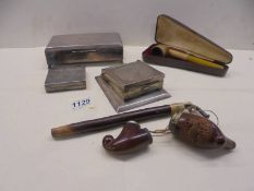 A mixed lot of cigarette boxes and pipes.