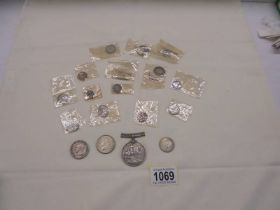 A mixed lot of 19c and earlier silver coins and a WW1 silver medal.