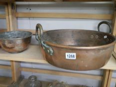 A Victorian copper pan and a smaller example.