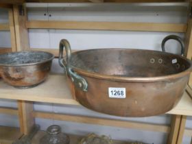 A Victorian copper pan and a smaller example.