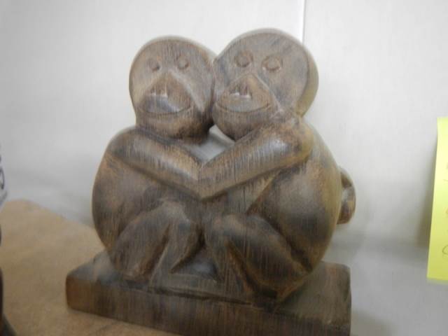 A carved wood figure of an orangutan and another carved ape figure. - Image 2 of 3