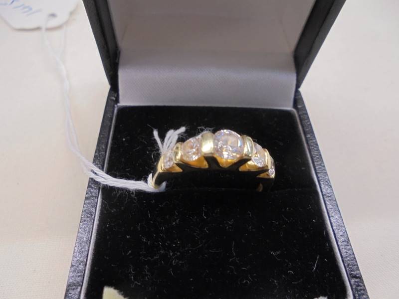 A silver gilt ring set CZ, size P, 3.9 grams.