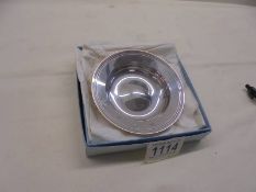 A hall marked silver wine tasting dish.