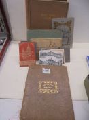 An old postcard album, and old photograph album and other albums.