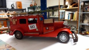 A large pressed steel and fibre glass model of a vintage American fire engine length 36cm