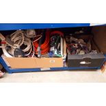 A quantity of extension leads, adapters, box of bungee cords etc