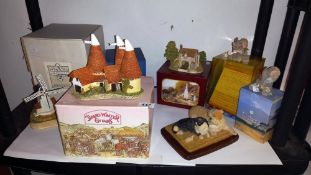 A collection of boxed ornaments including David Winter, Sherratt and Simpson bulldog with cat etc.