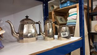 A 3 piece silver plate tea set, comprising teapot, hot water pot and milk jug
