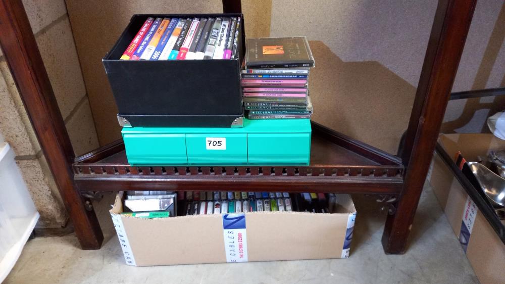 A box of music cassette tapes, box of PC cd games, quantity of cd's etc