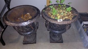 A pair of cast iron garden urns. (Top 37.50 cm Diameter, Base 18.50 cm x 18.50cm. Height 47.50