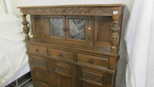 A carved oak buffet sideboard. COLLECT ONLY.