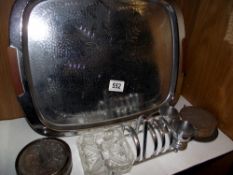 2 sets of silver plate coasters in stands, a toast rack incorporating egg cups and butter dish and a