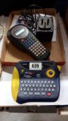 A Brother P-touch 1000 and Brother P-touch 2500 label maker with Brother electric plug
