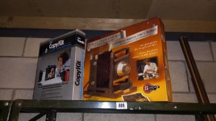 A boxed model paper camera model kit & a slides onto video copy Kat