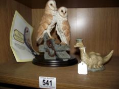 A Royal Doulton owl group and a Beswick Loch Ness monster flask (no contents)