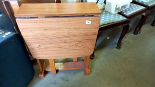 A drop leaf Formica table COLLECT ONLY.