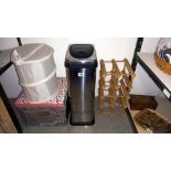 A stainless steel kitchen bin, pine wine rack, London underground collapsible storage box etc