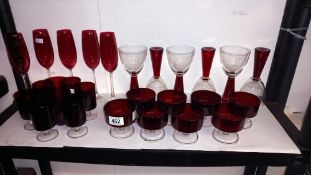 A good lot of red glass including champagne flutes, sundae dishes etc