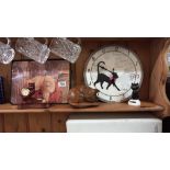 A cat clock, wooden cat, and other cat related items