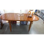 An extending solid pine dining table COLLECT ONLY