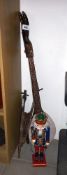 A tourist tribal one string 'guitar', oak bellows and a German soldier nutcracker