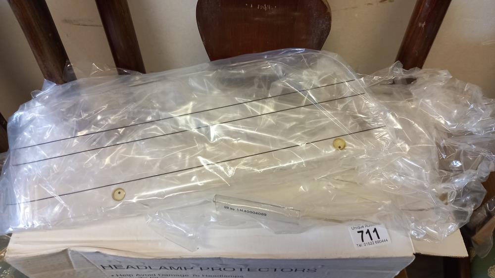 A boxed Volvo 440/460 series 94 onwards part no 40004089 headlamp guards - Image 2 of 2