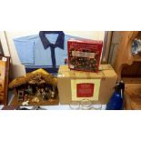 A boxed nativity set and box of Christmas lights (donkey in nativity is a/f)