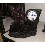 A bronzed resin classical themed mantle clock
