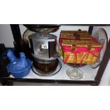 A shelf of kitchenalia including Pyrex, chicken egg dish, wicker basket etc