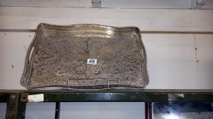 A large silver plate tray
