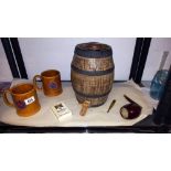 A vintage stoneware barrel, large pottery pipe, 2 Manikin cigar tankards etc