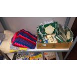 2 shelves of sewing/knitting/crocheting magazines, plus a knitted blanket, a crocheted blanket,