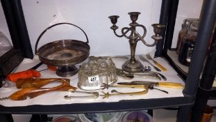 A silver plate candleabra, dish, jelly mould, bottle openers etc
