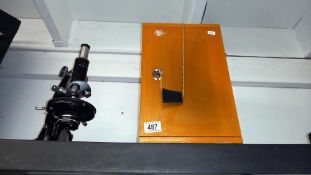 A cased microscope.
