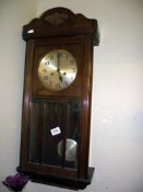 A 1930's oak wall clock - COLLECT ONLY