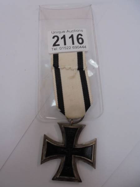 An Iron cross medal dated 1914.