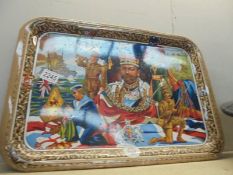 A vintage tin tray depicting royalty.
