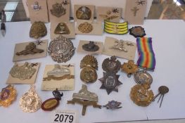 A 1914-1918 medal for 3262 Pte H Pearson Lanc. Fusiliers and a selection of cap & pin badges
