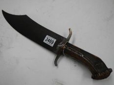 A large heavy Bowie knife with antler grip, length 47 cm, blade 32 cm.