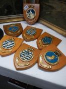 Seven military shields including Naval Air Squadron 819, HMS Monkton, HMS Bronington, RFA Engadine