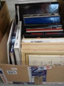 A box of military books relating to helmets, medals, uniforms etc,,