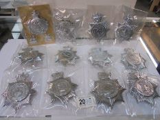 Twelve large police badges for various constabularys.